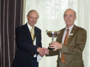 President Gordon presenting the trophy to Stuart Brown